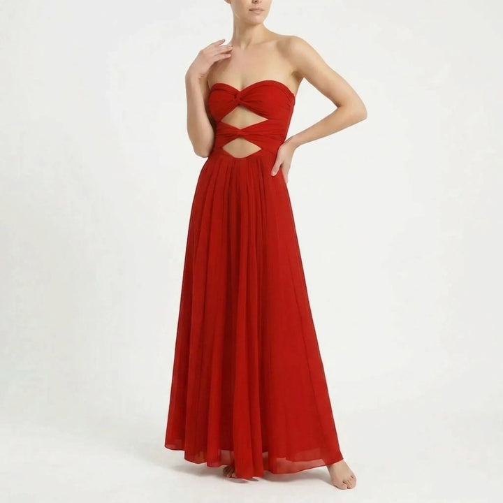 Elegant women's resort outfit: cutout swimsuit with a flattering long skirt cover-up.