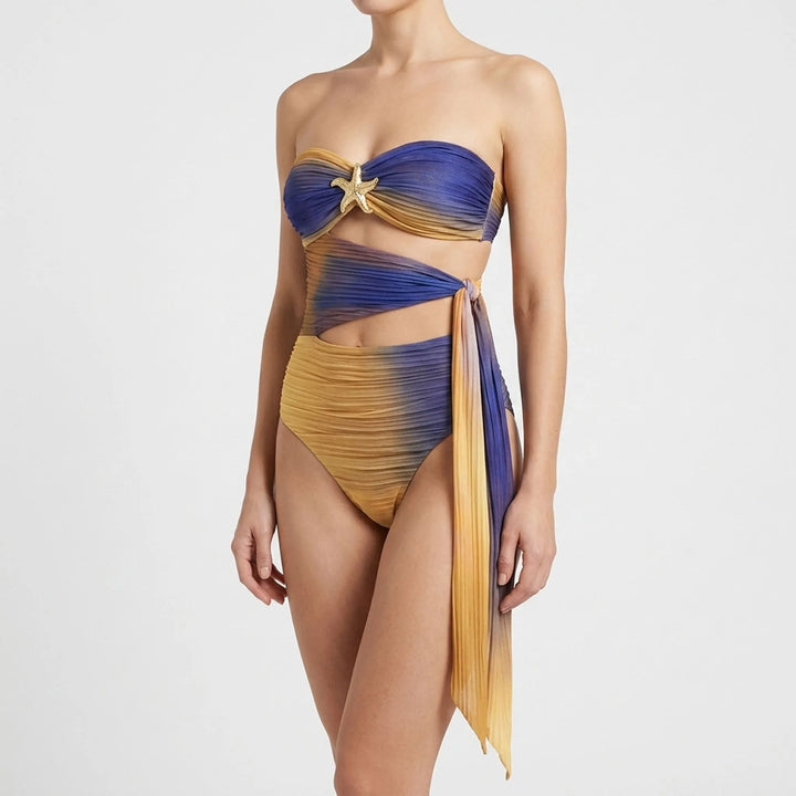 Women's vacation swimwear: cutout bandeau top, matching bottom, & beautiful long skirt.