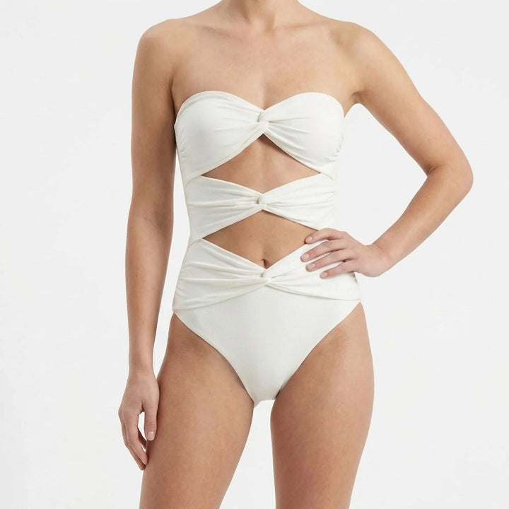 Trendy women's beachwear: cutout swimsuit with a sophisticated long skirt cover-up.
