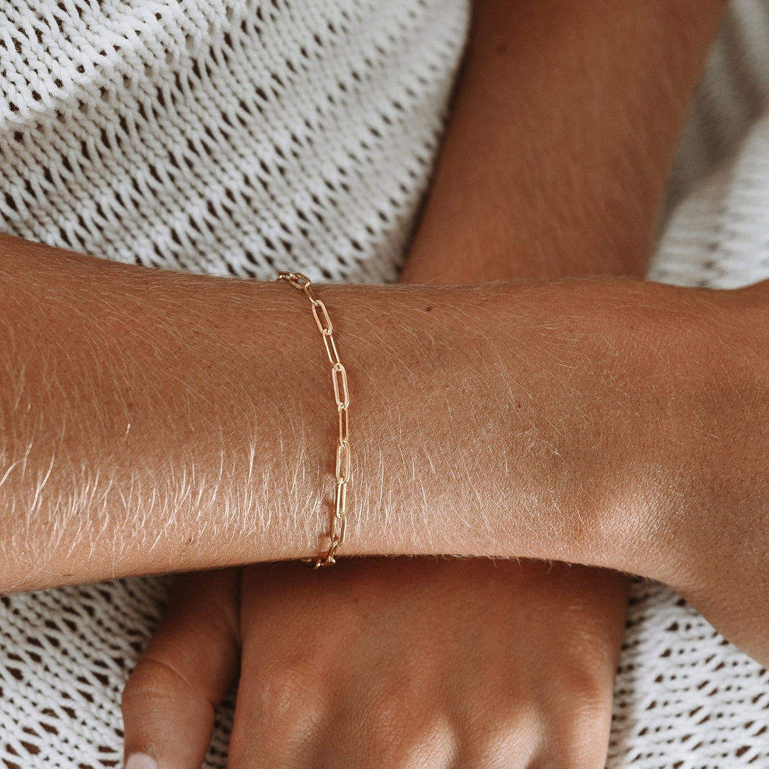 Women's dainty silver paperclip link chain bracelet. Adjustable & hypoallergenic for sensitive skin. Everyday elegance.