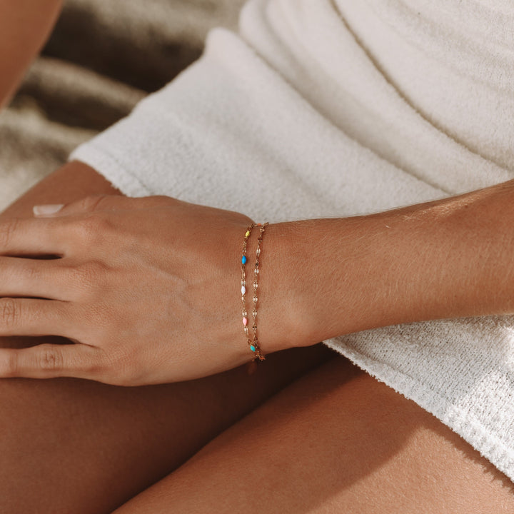 Delicate women's rainbow chain bracelet, vibrant colors. Versatile dainty jewelry for women.