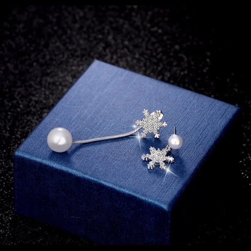 Sterling silver dainty snowflake drop earrings, an elegant winter jewelry holiday gift for her.