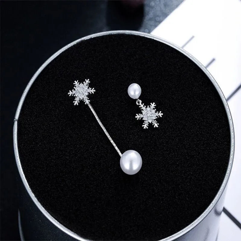 Festive & elegant sterling silver snowflake drop earrings, perfect dainty winter jewelry fashion accessory.