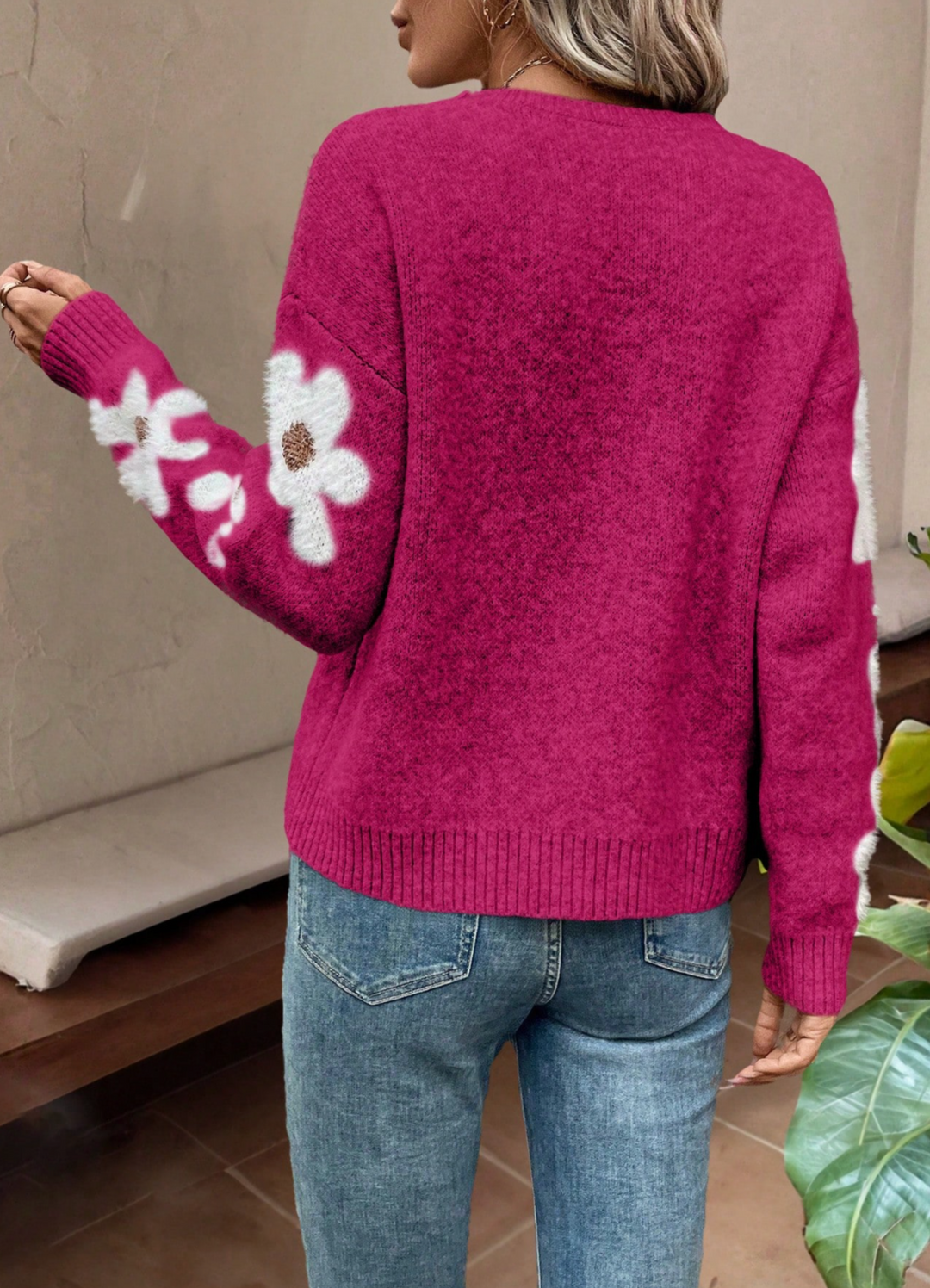 Women's cozy drop shoulder sweater with beautiful daisy floral knit pattern for autumn.