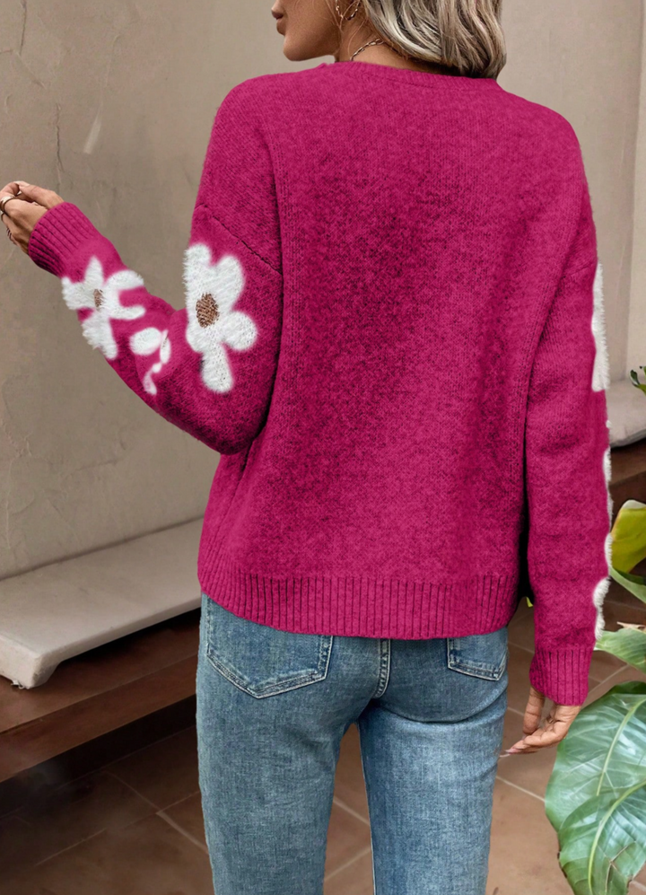 Women's cozy drop shoulder sweater with beautiful daisy floral knit pattern for autumn.