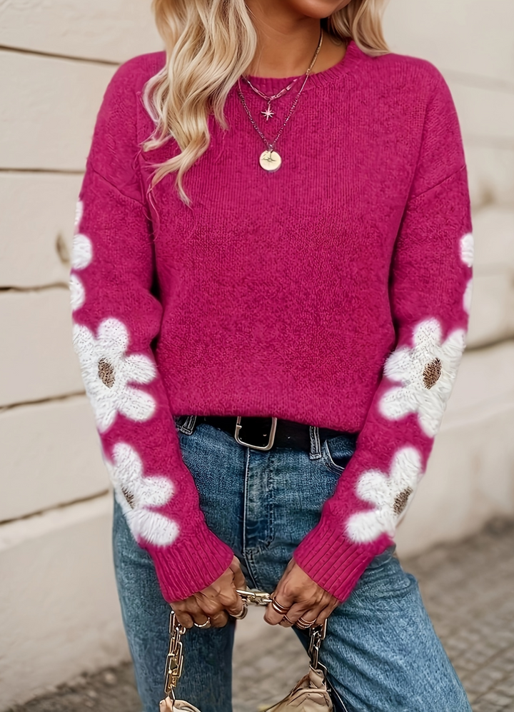 Stylish women's daisy floral sweater. Comfortable relaxed fit knitwear for any season.
