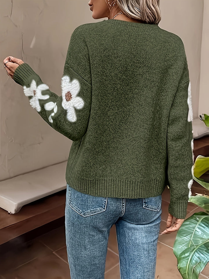 Women's comfortable floral sweater featuring a daisy design and relaxed drop shoulder.