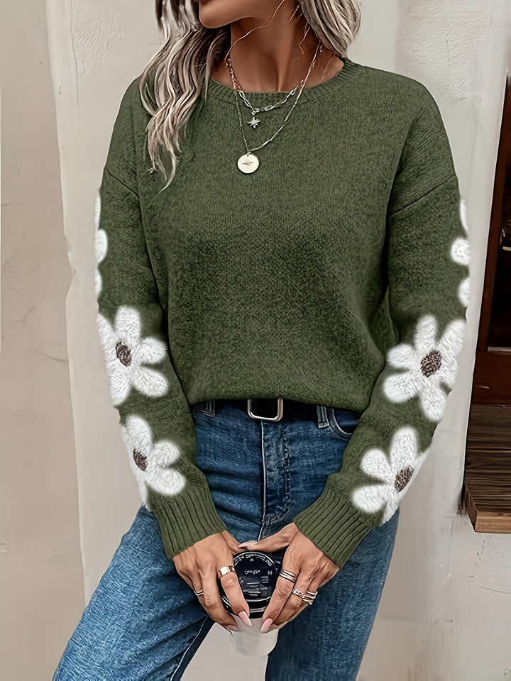 Winter cozy women's knitwear: daisy drop shoulder floral sweater, stylish and warm.