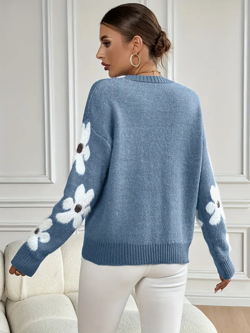 Relaxed fit women's sweater with stylish daisy floral design. Perfect for casual comfort.