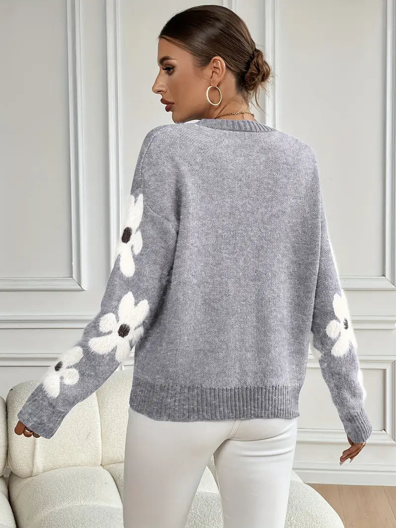 Women's comfortable daisy drop shoulder sweater. Floral design, stylish casual wear top.