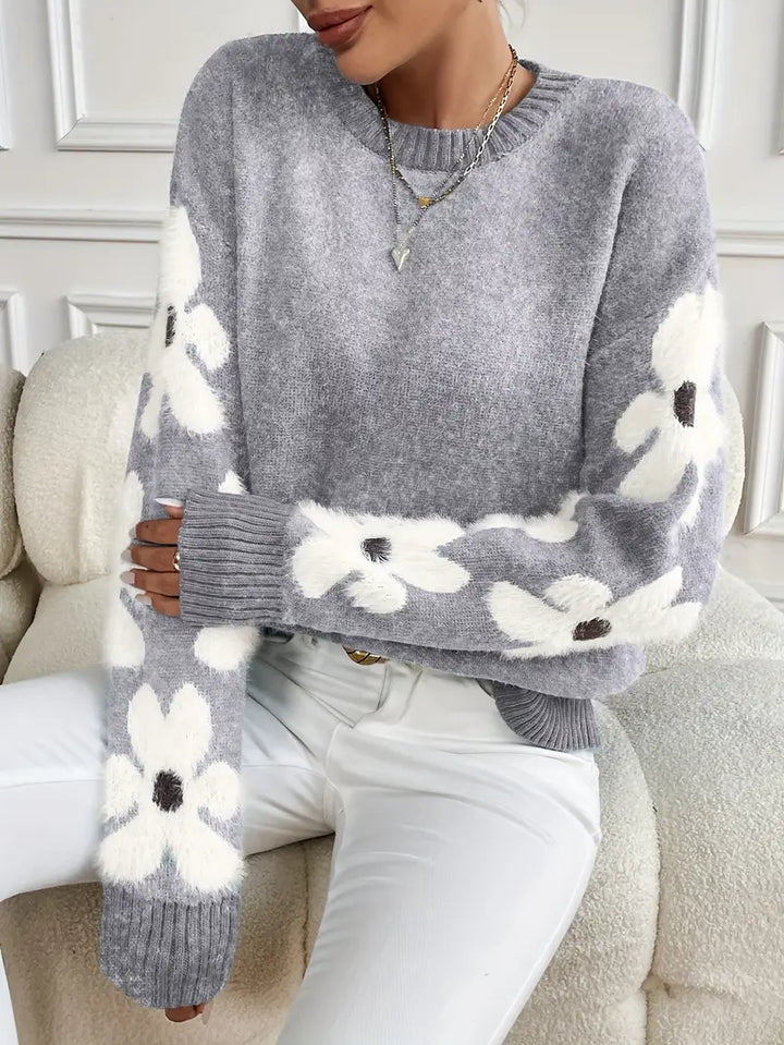 Autumn women's sweater: drop shoulder, daisy floral pattern, soft knitwear comfort.