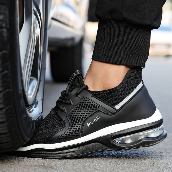 Black & dark gray protective safety sneakers for women, featuring steel toe and slip-resistant grip.