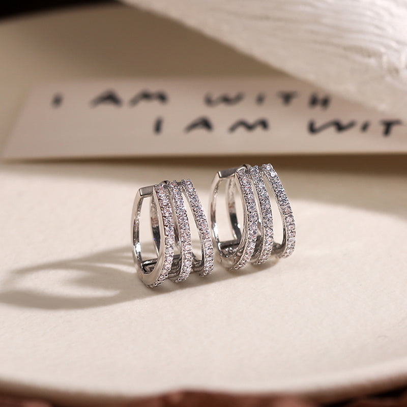 Elegant brilliant statement earrings for women, sparkling cubic zirconia jewelry.
