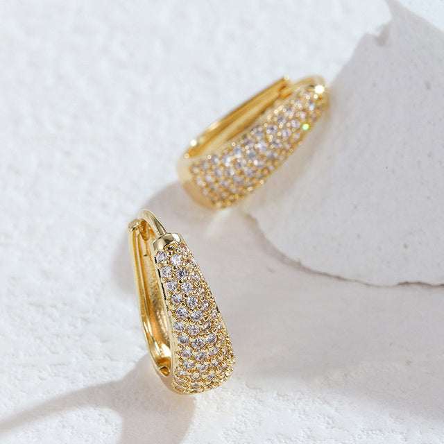 Gold-tone dazzling brilliant statement earrings with sparkling crystals for women.