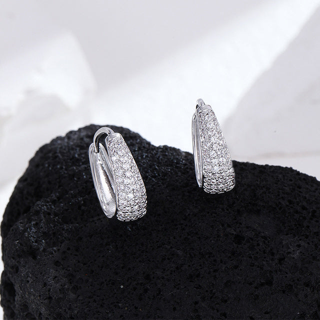 Silver-tone brilliant dangle earrings for women, with sparkling cubic zirconia.