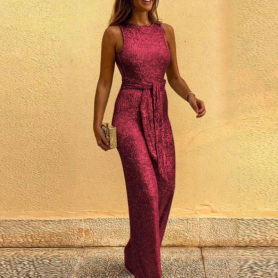 Dazzling gold glitter jumpsuit for women, an eye-catching party wear garment for glamorous evening fashion.