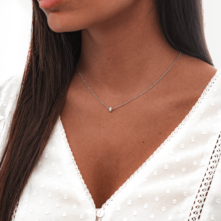 Sparkling zirconia circle pendant necklace for women. Gold-plated sterling silver, adjustable chain.