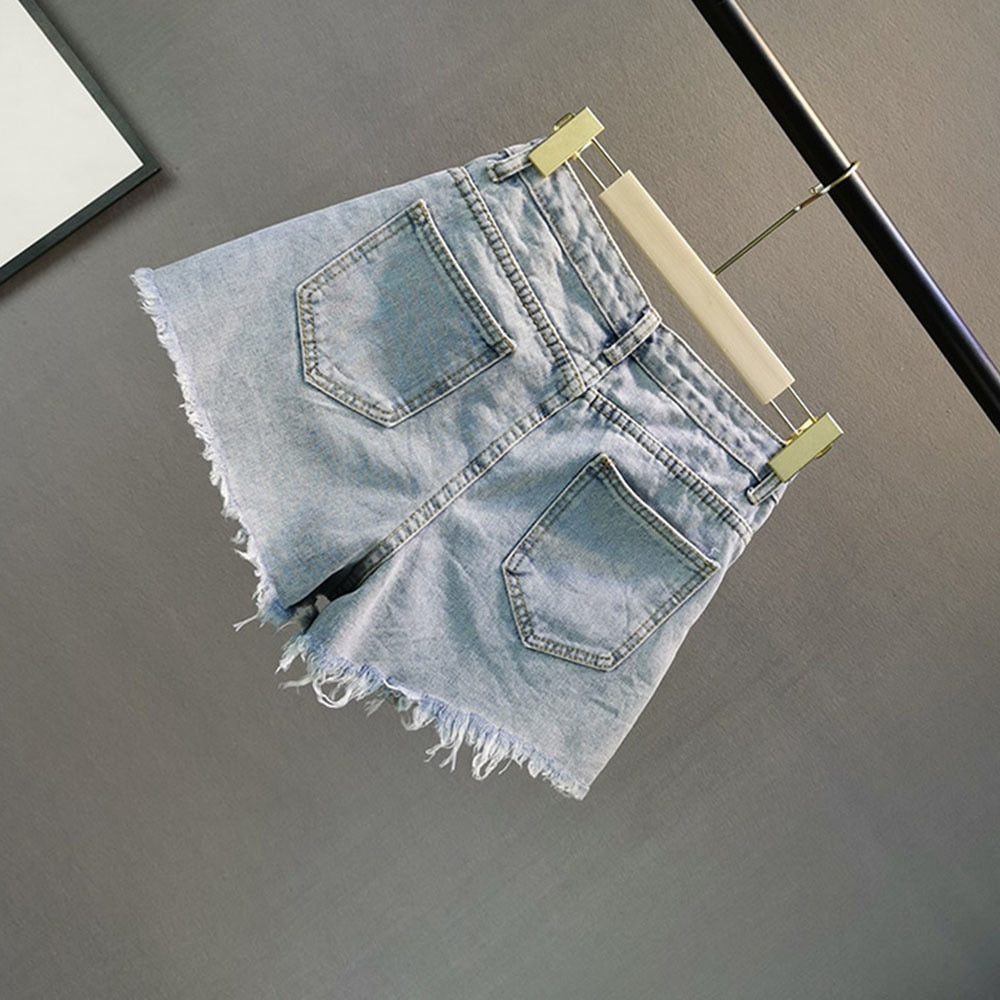 Sparkling light blue high-waist women's shorts with dazzling diamond embellishments for stylish party wear.