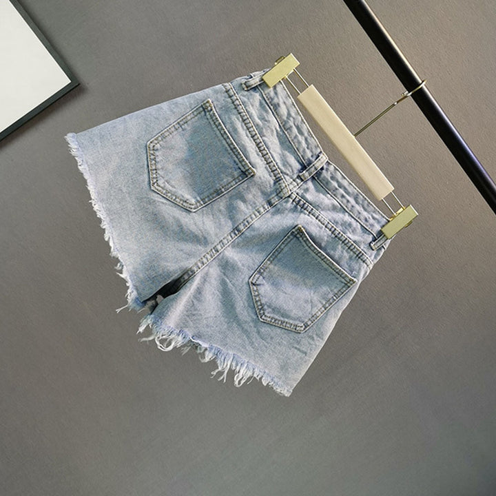 Sparkling light blue high-waist women's shorts with dazzling diamond embellishments for stylish party wear.