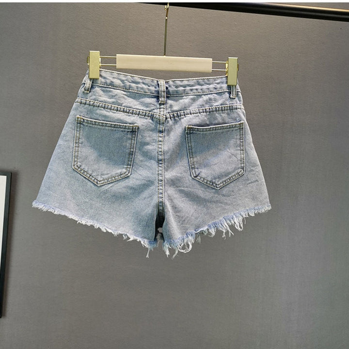 Light blue high-waist women's shorts. Dazzling diamond sparkle for trendy summer, evening, or party fashion.