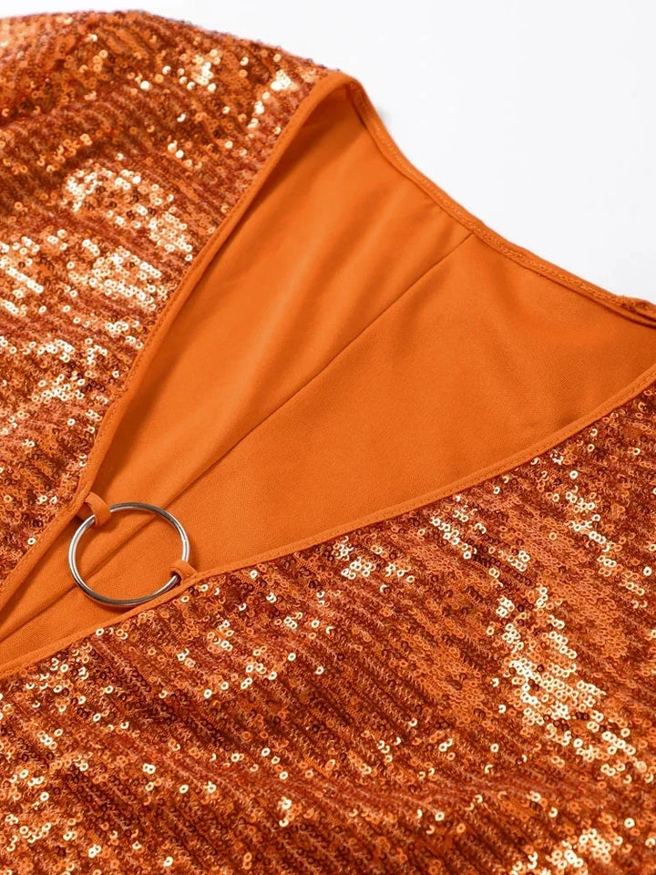 Glamorous orange sequin V-neck mini dress for women, featuring a dazzling sparkle, ideal for cocktail parties.