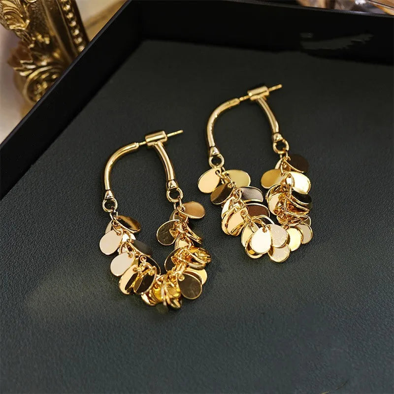 Women's dazzling sequin tassel drop earrings, perfect for glamorous party wear and making a statement.