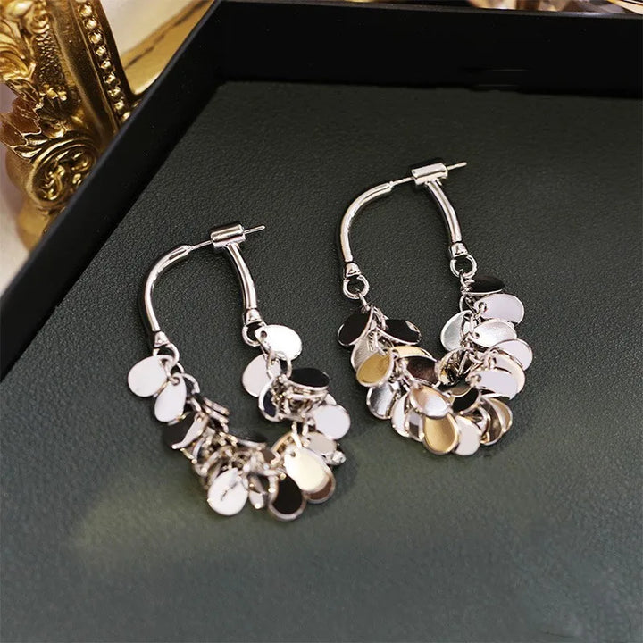 Sparkling sequin tassel dangle earrings, a chic fashion accessory for women's statement jewelry.