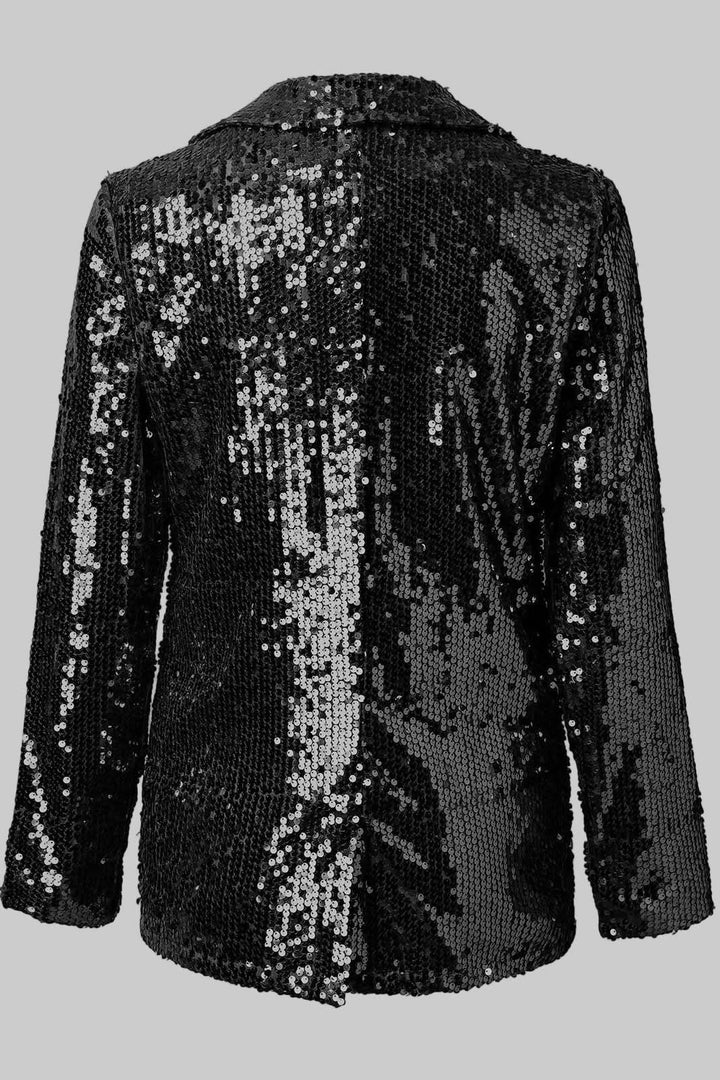 Embellished women's blazer, shimmering for a dazzling, glamorous evening party outfit.