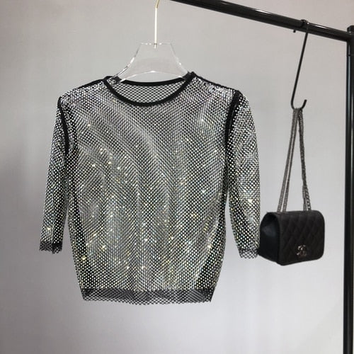 Sparkling women's party t-shirt, dazzling glitter top, one-size festive wear for nights out.