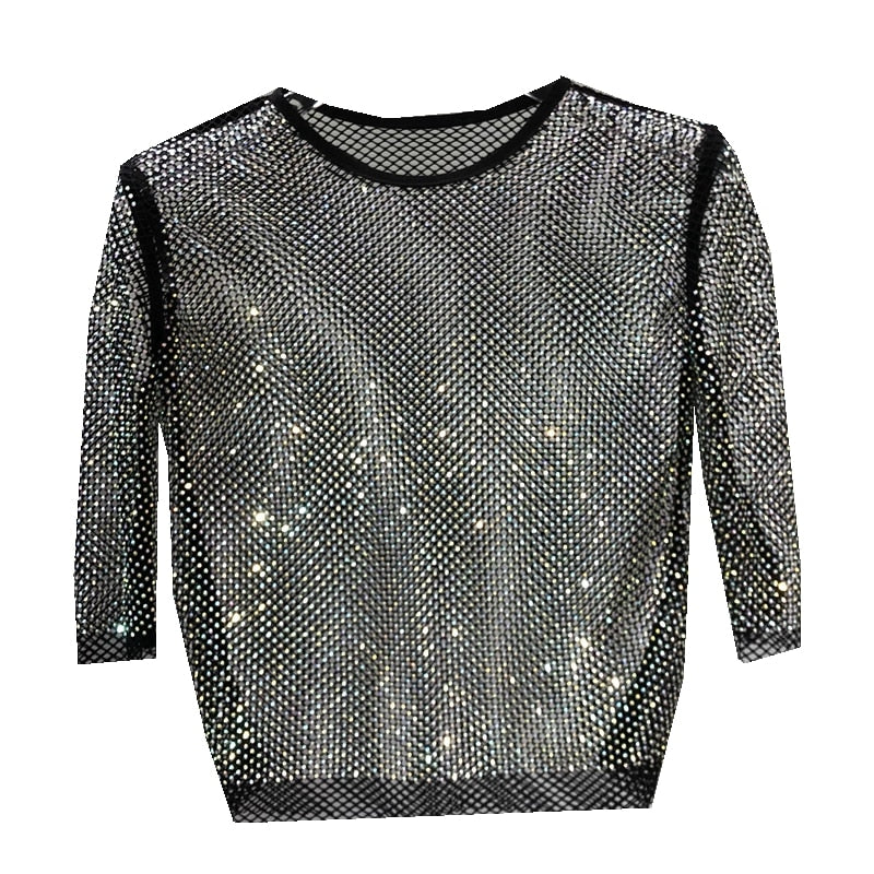 Casual glam women's shiny party top, metallic glitter t-shirt for fashionable nights out.