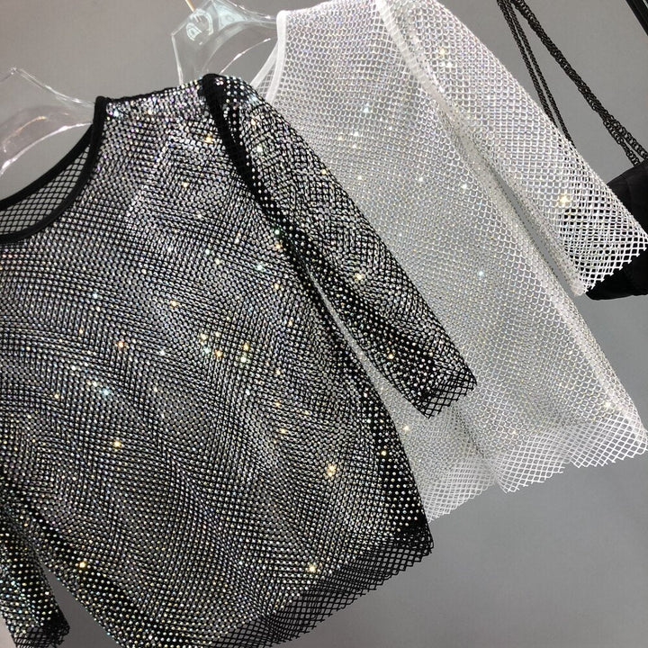 Dazzling women's fashion party t-shirt, shiny metallic top with glitter for night-out sparkle.