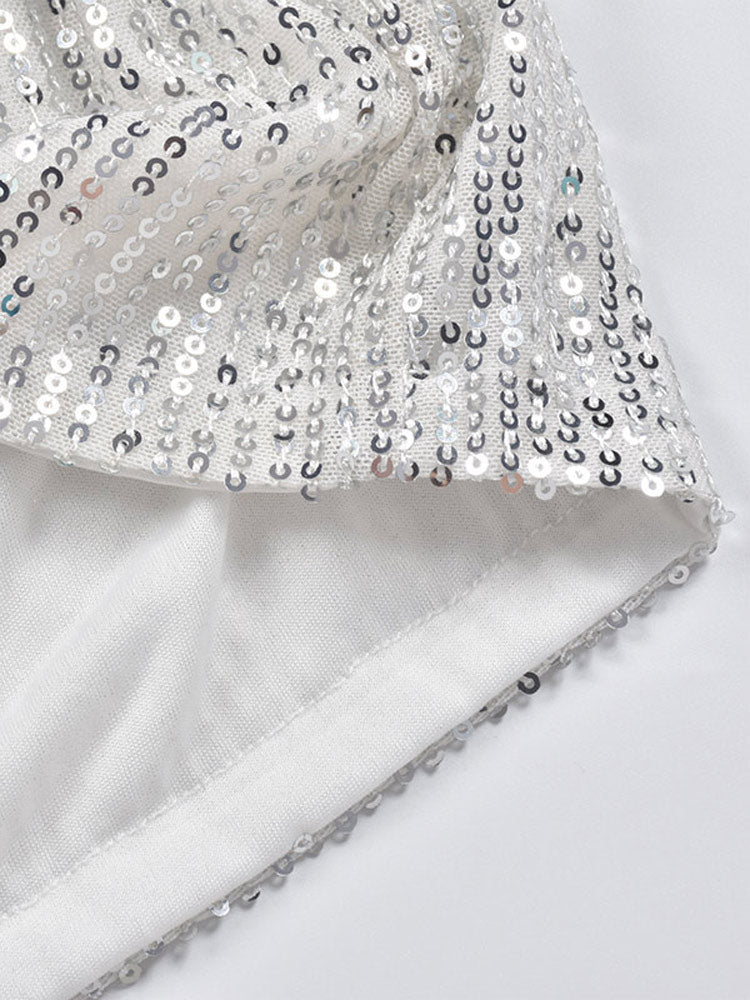 Back view of women's sparkling silver sequin shorts, highlighting comfortable fit for dazzling party wear.