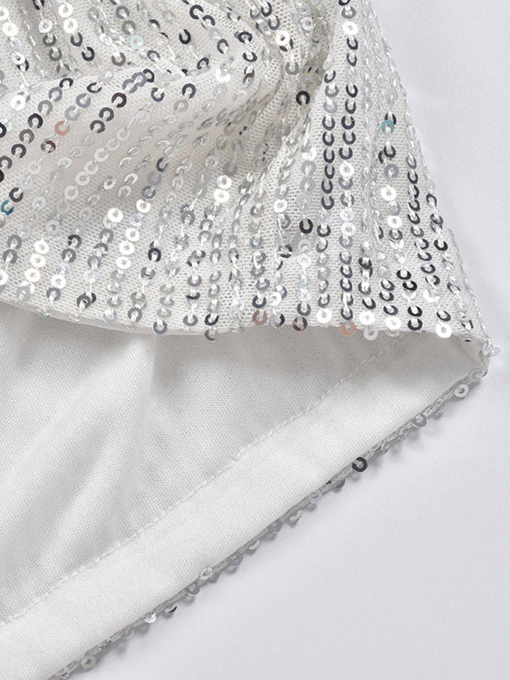 Back view of women's sparkling silver sequin shorts, highlighting comfortable fit for dazzling party wear.