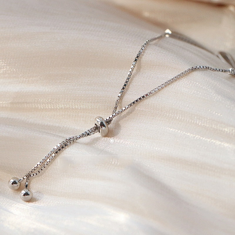 Women's elegant sterling silver tennis bracelet, featuring brilliant zirconia stones for a dazzling look.