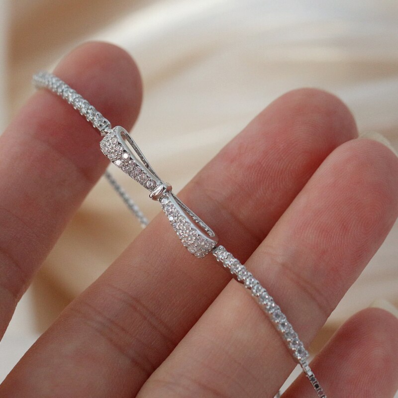 Dazzling women's rhinestone tennis bracelet with brilliant zirconia stones, crafted in elegant silver jewelry.