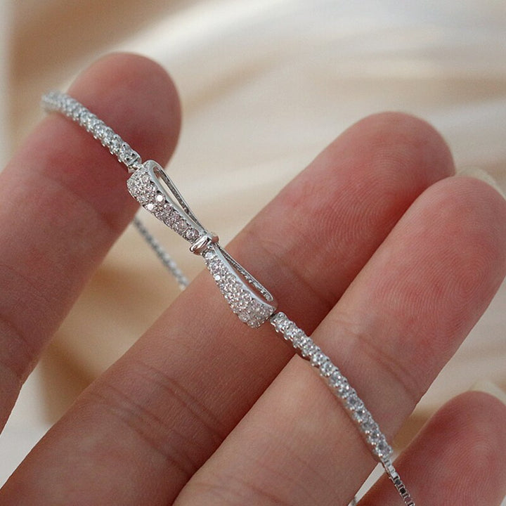 Dazzling women's rhinestone tennis bracelet with brilliant zirconia stones, crafted in elegant silver jewelry.
