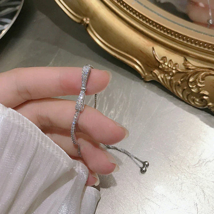 Brilliant-cut zirconia stones set in a stunning silver tennis bracelet, a dazzling women's fashion accessory.