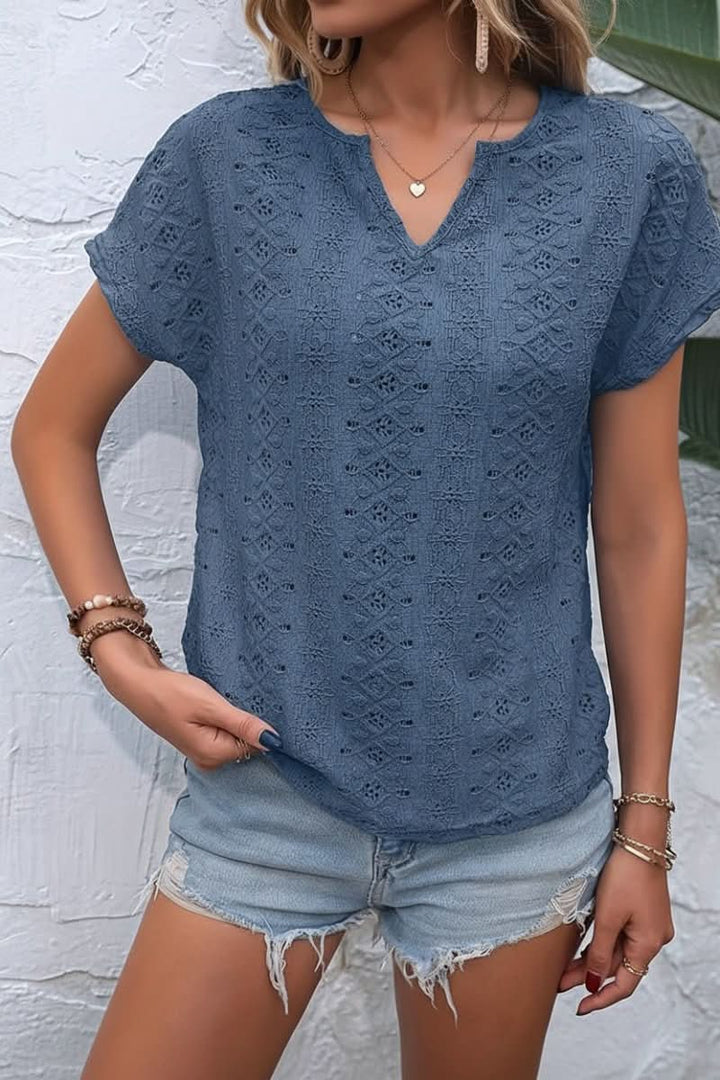 Casual women's eyelet top with a stylish notched neckline, ideal for daily summer outfits.