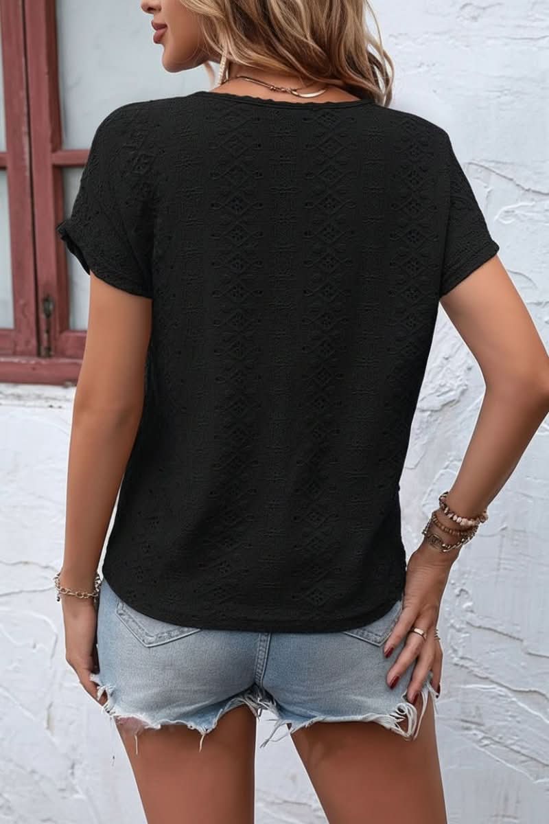 Delicate eyelet women's top with a trendy notched neck, a versatile short sleeve for any casual look.