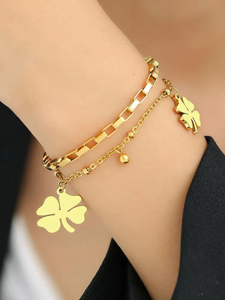 Adjustable gold & silver four-leaf clover bracelet, a delicate lucky charm and elegant gift for women.