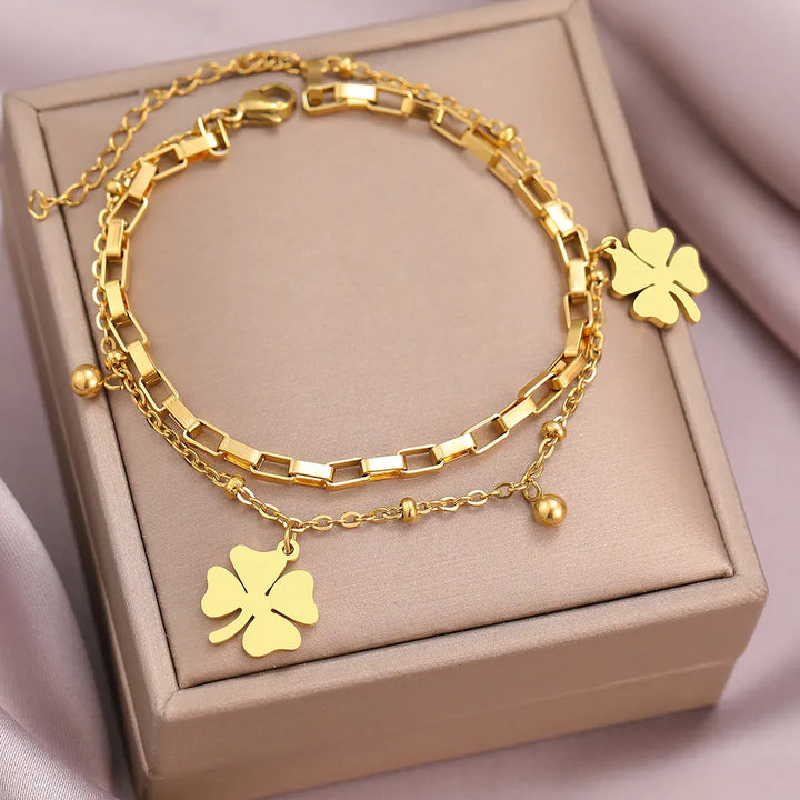 Delicate gold four-leaf clover lucky charm bracelet for women, combining elegance with a meaningful symbol. Adjustable.