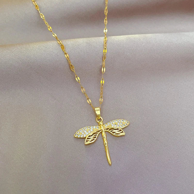 Women's delicate gold plated dragonfly necklace, elegant nature-inspired jewelry.
