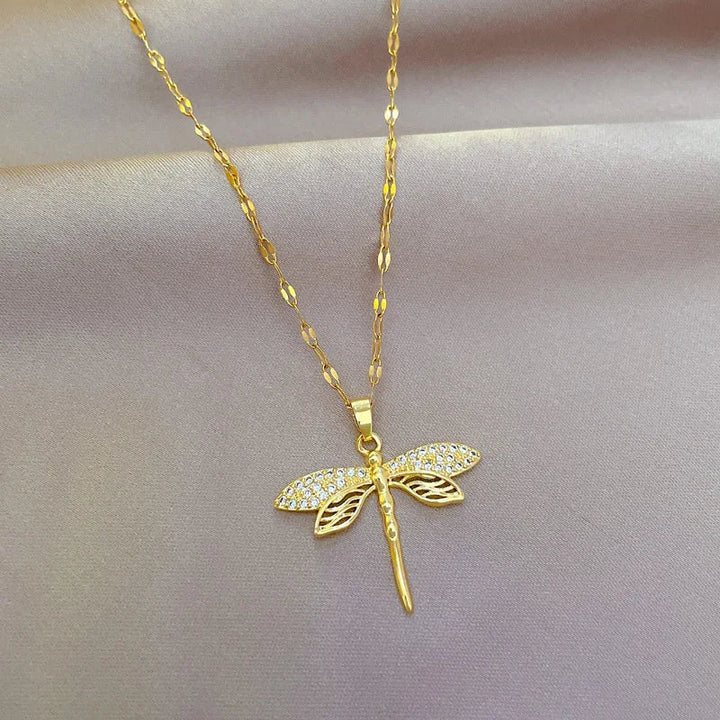 Women's delicate gold plated dragonfly necklace, elegant nature-inspired jewelry.
