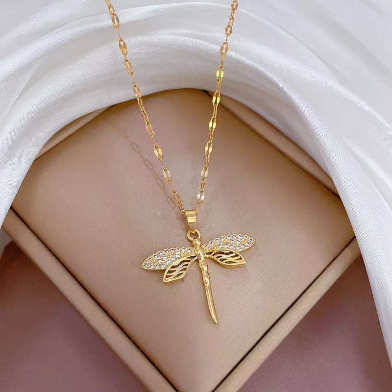 Elegant gold dragonfly necklace, a delicate nature-inspired gift for women. Perfect jewelry.