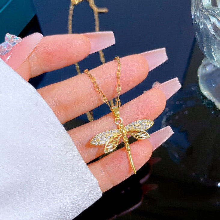 Dainty women's golden dragonfly necklace, gold plated for a delicate and elegant finish.