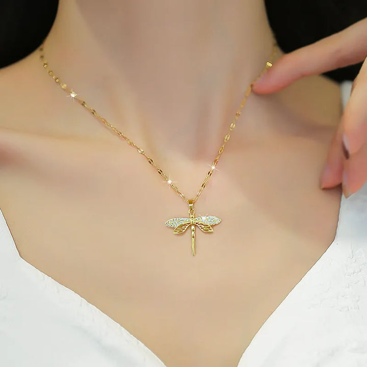 Stunning golden dragonfly necklace for women, elegant gold plated jewelry with a nature touch.
