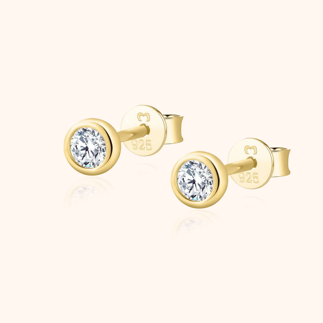 Women's delicate gold-plated sterling silver circle earrings with sparkling zirconia studs.