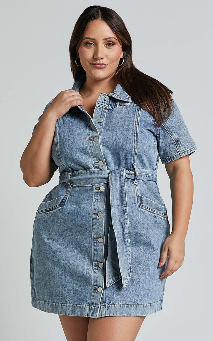 Comfortable women's button-down denim mini dress. Essential fall wardrobe piece for stylish autumn fashion.