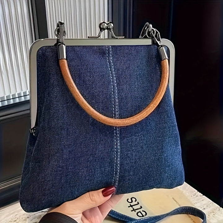 Women's denim & leather frame shoulder bag with sturdy frame and elegant leather strap. Modern vintage style handbag.
