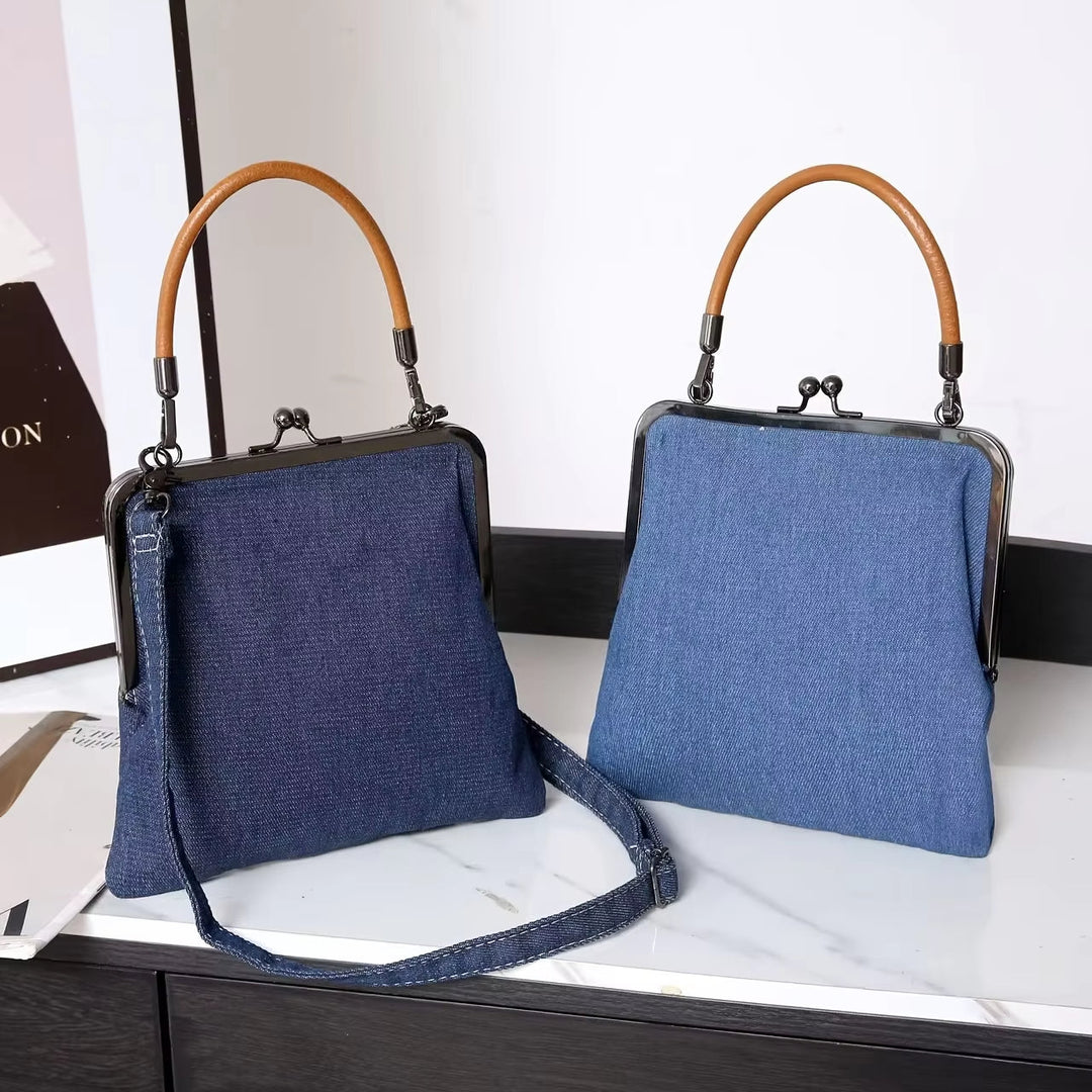 Elegant women's denim & leather shoulder bag, a versatile frame handbag perfect for adding a vintage touch to outfits.